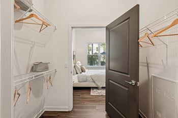 A room with a brown door and a white wall